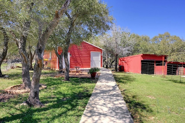 view of yard featuring an exterior structure and an outdoor structure