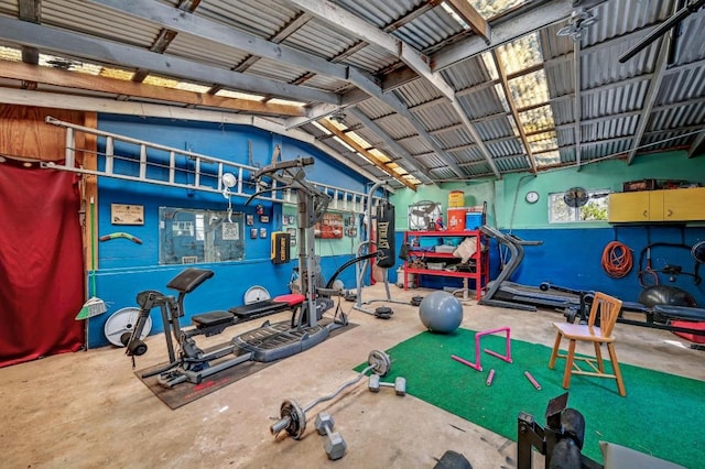 gym with vaulted ceiling