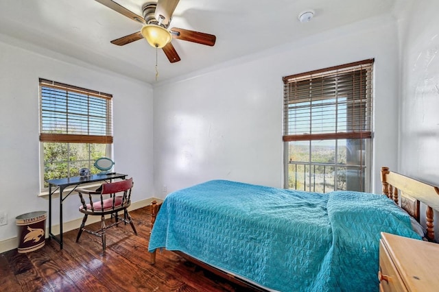 bedroom featuring baseboards and wood finished floors