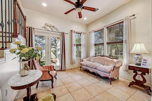 sitting room with light tile patterned floors, a ceiling fan, visible vents, baseboards, and recessed lighting