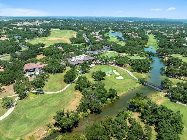 birds eye view of property with a water view and golf course view