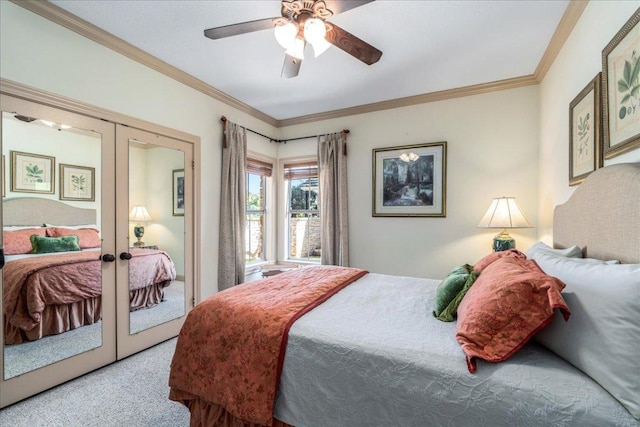 carpeted bedroom with a ceiling fan, french doors, and ornamental molding