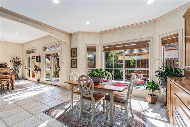 dining area with light tile patterned floors, ornamental molding, and recessed lighting