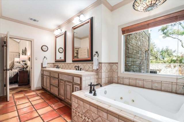 full bathroom featuring a healthy amount of sunlight, visible vents, ensuite bathroom, and a sink