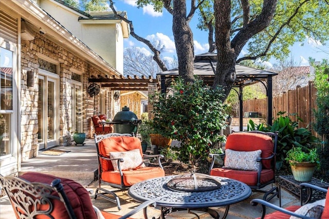 view of patio / terrace featuring a gazebo and fence