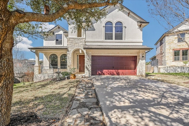 view of front of house with driveway, a porch, stucco siding, a garage, and stone siding