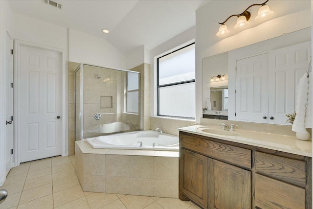 bathroom featuring vanity, visible vents, tile patterned flooring, a shower stall, and a garden tub