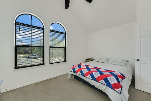 bedroom featuring vaulted ceiling, a ceiling fan, baseboards, and carpet floors