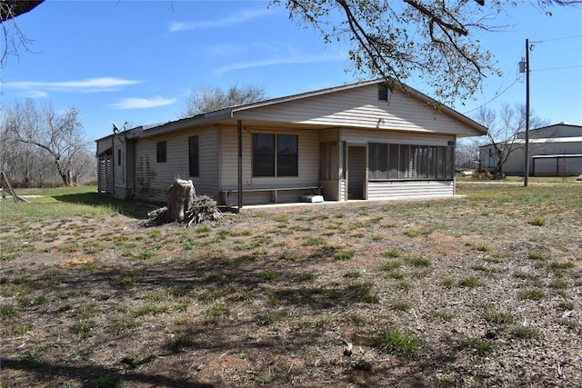 rear view of house with a sunroom