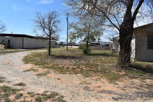 view of yard with a pole building