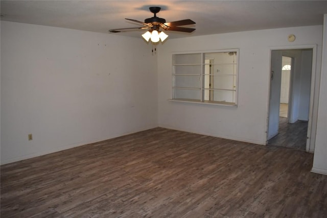 empty room featuring a ceiling fan and wood finished floors