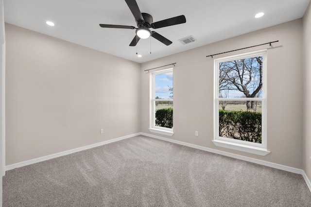 empty room featuring recessed lighting, visible vents, baseboards, and carpet flooring