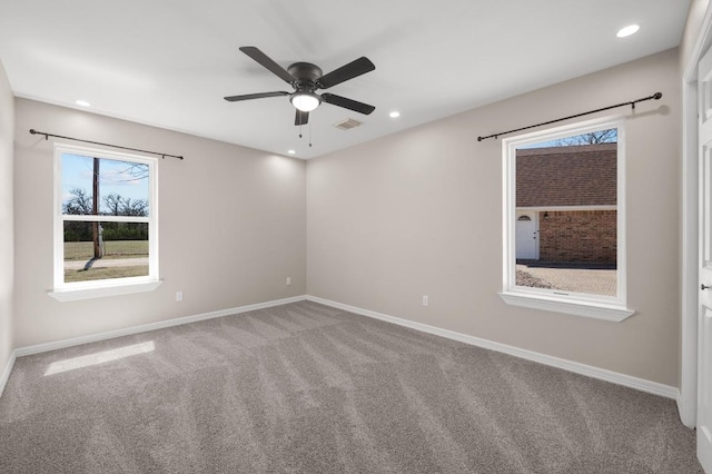 carpeted empty room with recessed lighting, visible vents, baseboards, and ceiling fan