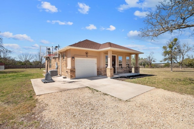 view of front of property with brick siding, a garage, driveway, and a front lawn