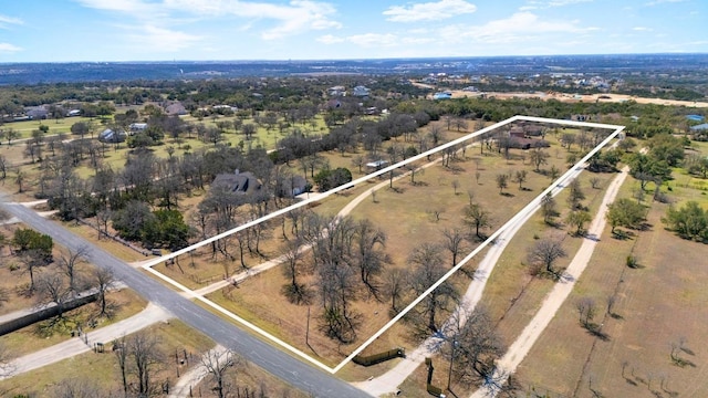 birds eye view of property featuring a rural view