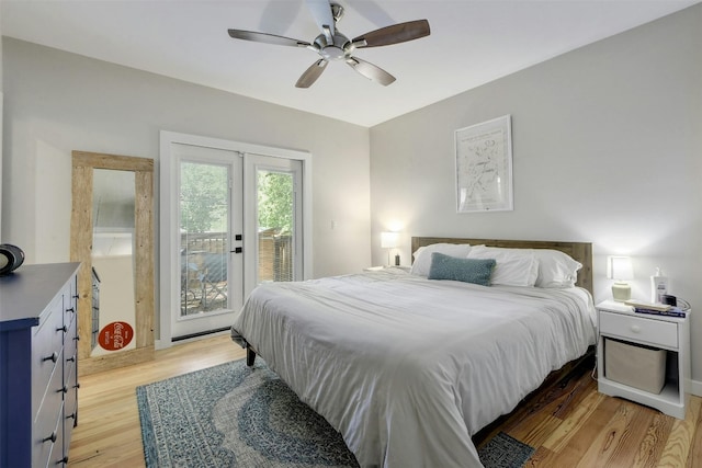 bedroom featuring access to exterior, french doors, a ceiling fan, and light wood-style floors