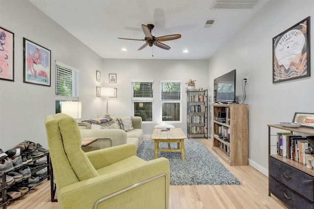 living room featuring visible vents, recessed lighting, a ceiling fan, and wood finished floors