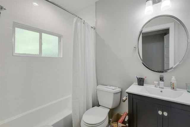 full bath with toilet, vanity, and shower / bath combo