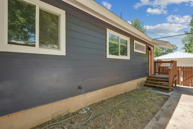 view of property exterior featuring a deck