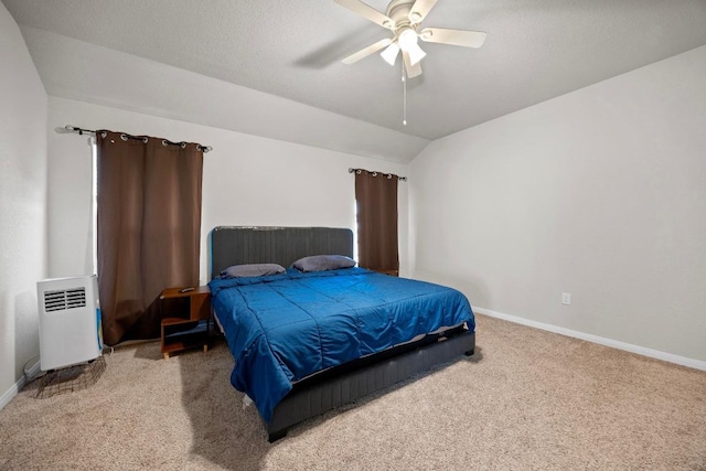 carpeted bedroom with radiator, baseboards, lofted ceiling, and a ceiling fan