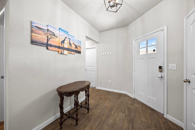 entryway featuring baseboards and dark wood-style floors