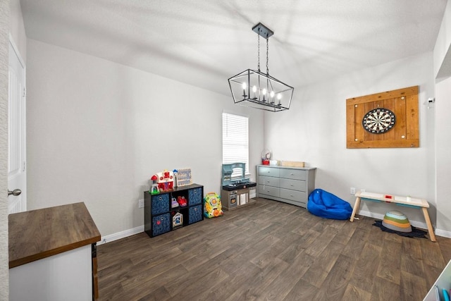 interior space with dark wood-style floors and baseboards