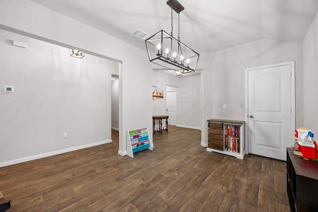 playroom featuring dark wood-type flooring, baseboards, visible vents, and lofted ceiling