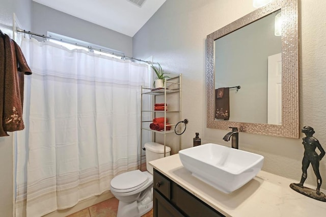 bathroom with vanity, toilet, a shower with curtain, and tile patterned flooring