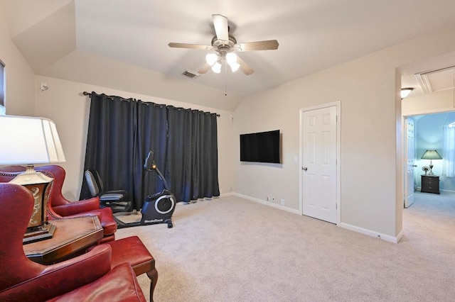 interior space featuring visible vents, lofted ceiling, a ceiling fan, baseboards, and attic access