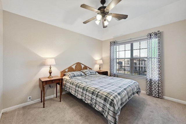 bedroom featuring ceiling fan, baseboards, and carpet floors