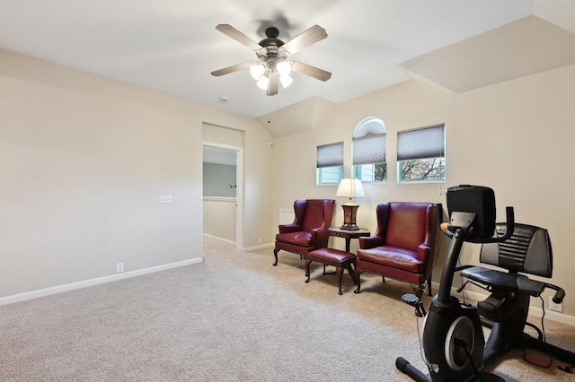 sitting room featuring baseboards, lofted ceiling, a ceiling fan, and carpet flooring