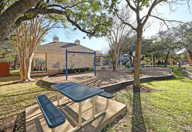 view of yard with fence and playground community