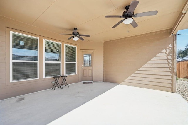 view of patio / terrace featuring a ceiling fan and fence