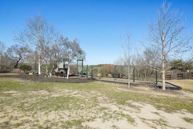 view of yard with playground community and fence