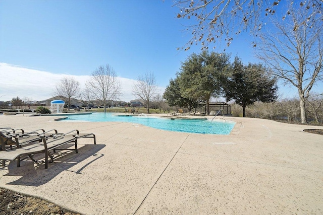 pool with a patio area