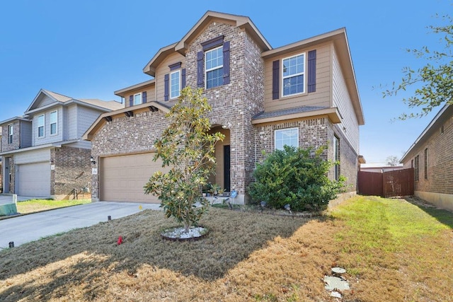 traditional-style home with brick siding, a front lawn, fence, a garage, and driveway