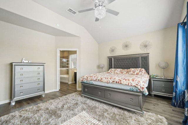 bedroom with visible vents, wood finished floors, baseboards, and vaulted ceiling