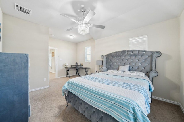 bedroom with ceiling fan, carpet, visible vents, and baseboards