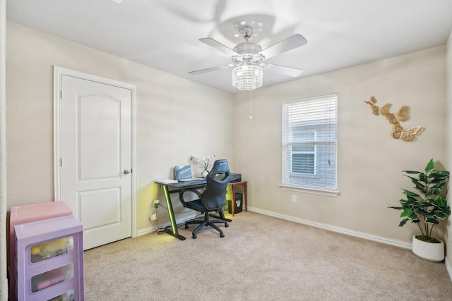 office area with baseboards, a ceiling fan, and carpet flooring