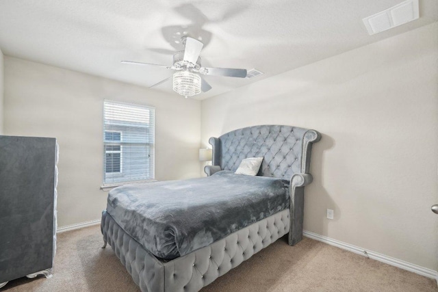 bedroom featuring visible vents, baseboards, carpet, and ceiling fan