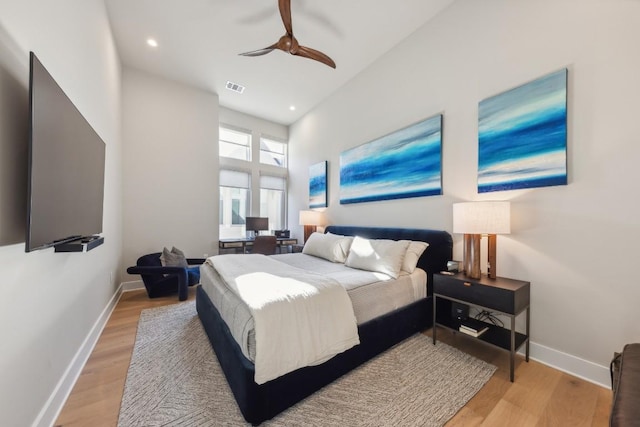 bedroom with recessed lighting, light wood-style flooring, visible vents, and baseboards