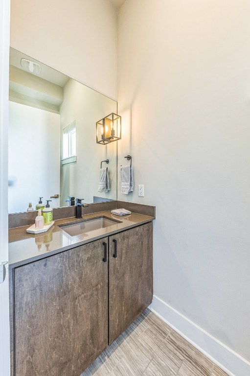 bathroom featuring vanity and baseboards