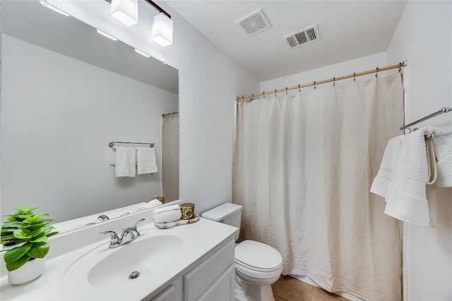 full bath featuring tile patterned floors, visible vents, toilet, and vanity