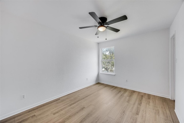 spare room with light wood-style floors, baseboards, and ceiling fan