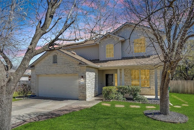 traditional-style home with an attached garage, fence, stone siding, and driveway