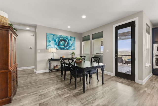 dining area featuring recessed lighting, baseboards, and light wood-style floors