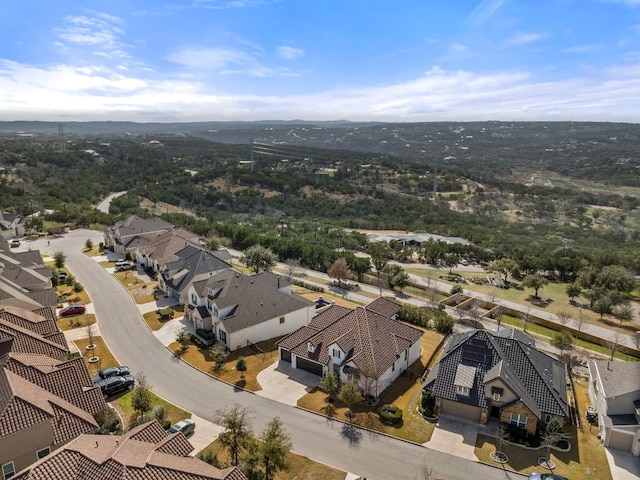 birds eye view of property with a residential view