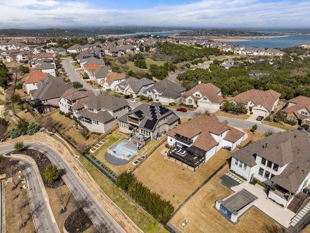 bird's eye view with a residential view and a water view