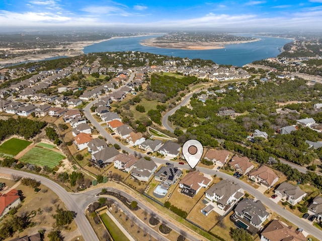 birds eye view of property with a residential view and a water view