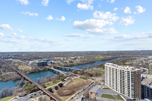 drone / aerial view with a city view and a water view